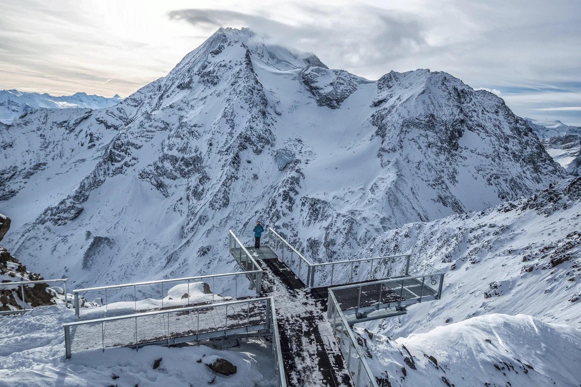 Woman overlooking French Alps from viewing platform